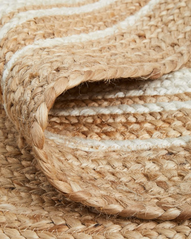Close-up of woven jute rope with natural beige color.