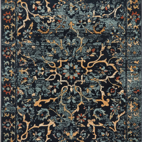 Decorative rug with intricate pattern on a dark blue background