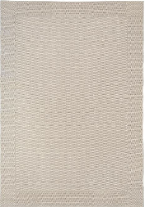 Beige area rug with a subtle pattern on a plain background
