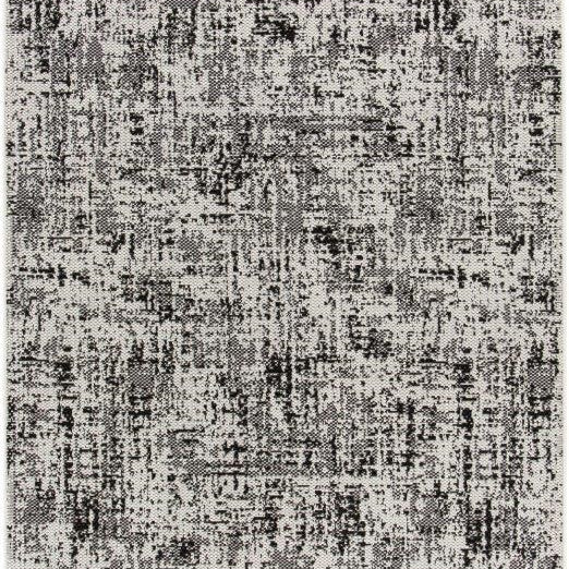 A square area rug with an abstract distressed pattern in shades of gray, black, and off-white.