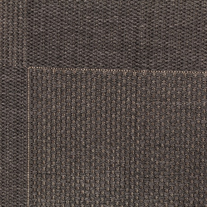 Close-up of brown textured fabric with a visible seam.