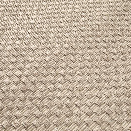 Close-up of a textured beige fabric with a woven pattern