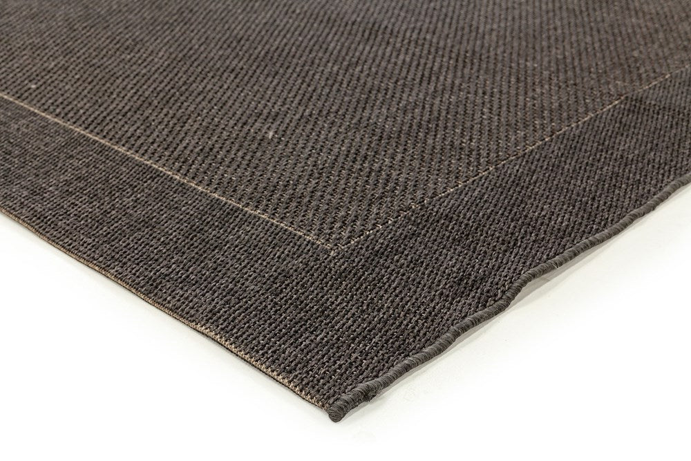 Close-up of a brown textured fabric on a white background