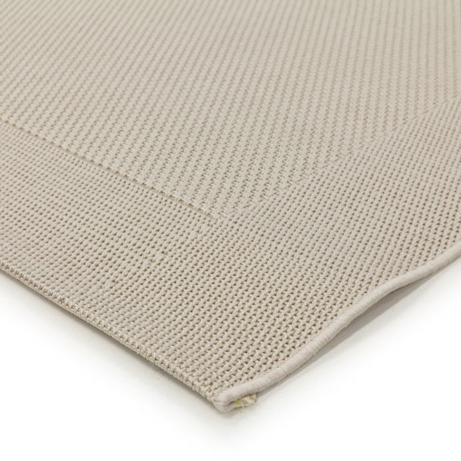 Close-up of a beige textured fabric on a white background
