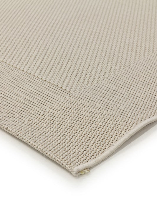 Close-up of a beige textured fabric on a white background