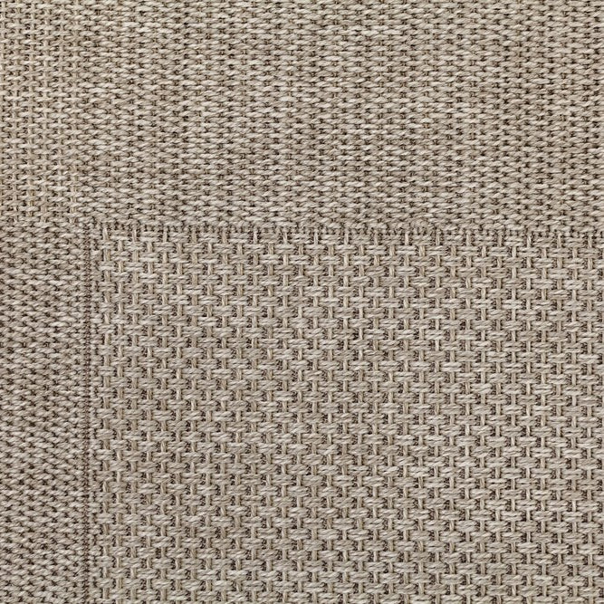 Close-up of a textured beige fabric surface