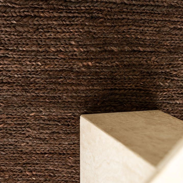 Textured brown wall with a white rectangular object