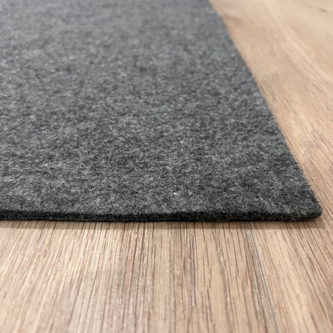 Gray rug on a wooden floor