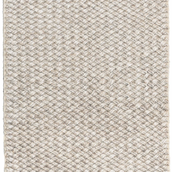 Textured beige rug with a subtle pattern