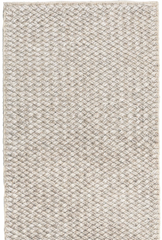 Textured beige rug with a subtle pattern