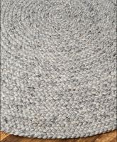 Round rug on timber flooring