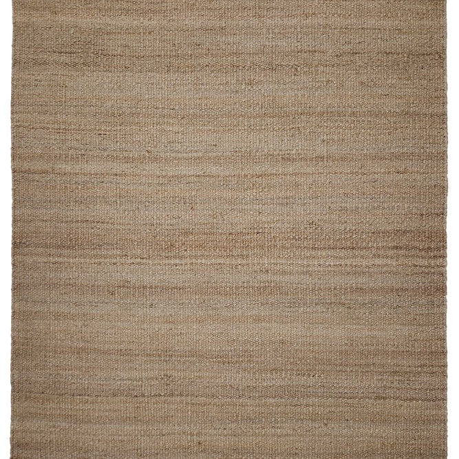 Beige area rug with a textured pattern on a white background