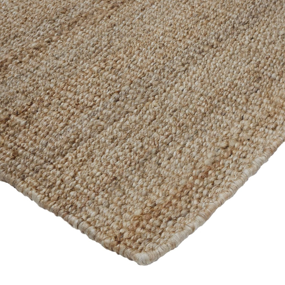 Close-up of a beige carpet corner on a white background