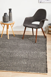 Black and white rug on timber flooring