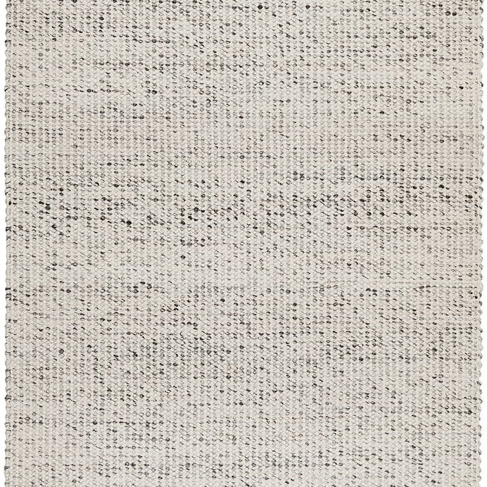 A grey wool area rug with a flatweave design and hand loomed construction.
