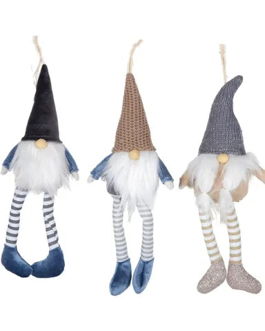 Three decorative gnomes with different hats and outfits on a white background