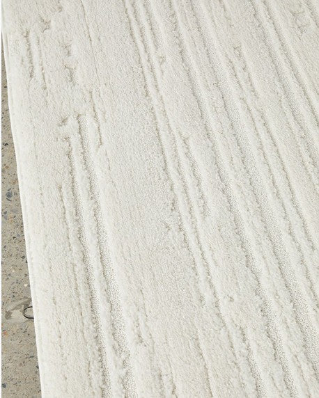 Close-up of a textured white surface with horizontal lines