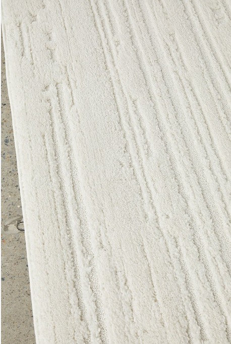Close-up of a textured white surface with horizontal lines