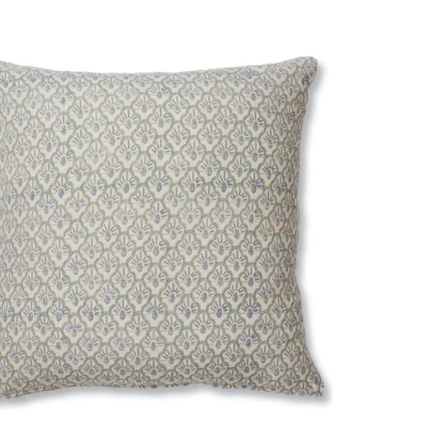 Decorative pillow with a subtle pattern on a white background