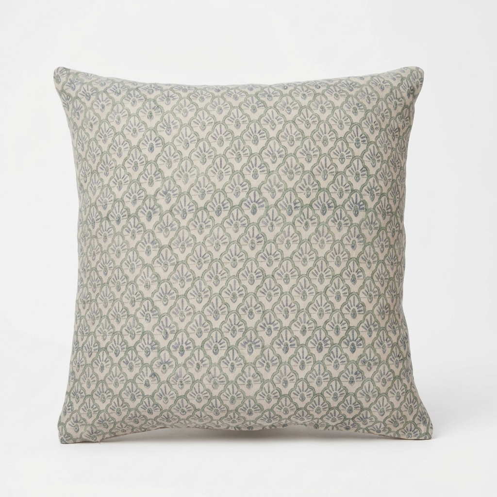 A square throw pillow featuring a repeating muted sage green and beige geometric block print pattern, shown against a plain white background.