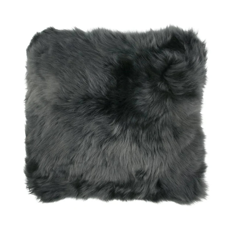 Gray sheepskin wool pillow on a white background