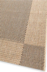 Close-up of a textured beige rug with a grid pattern on a white background