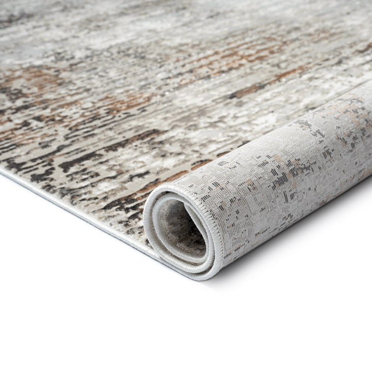 Rolled-up area rug with a textured pattern on a white background