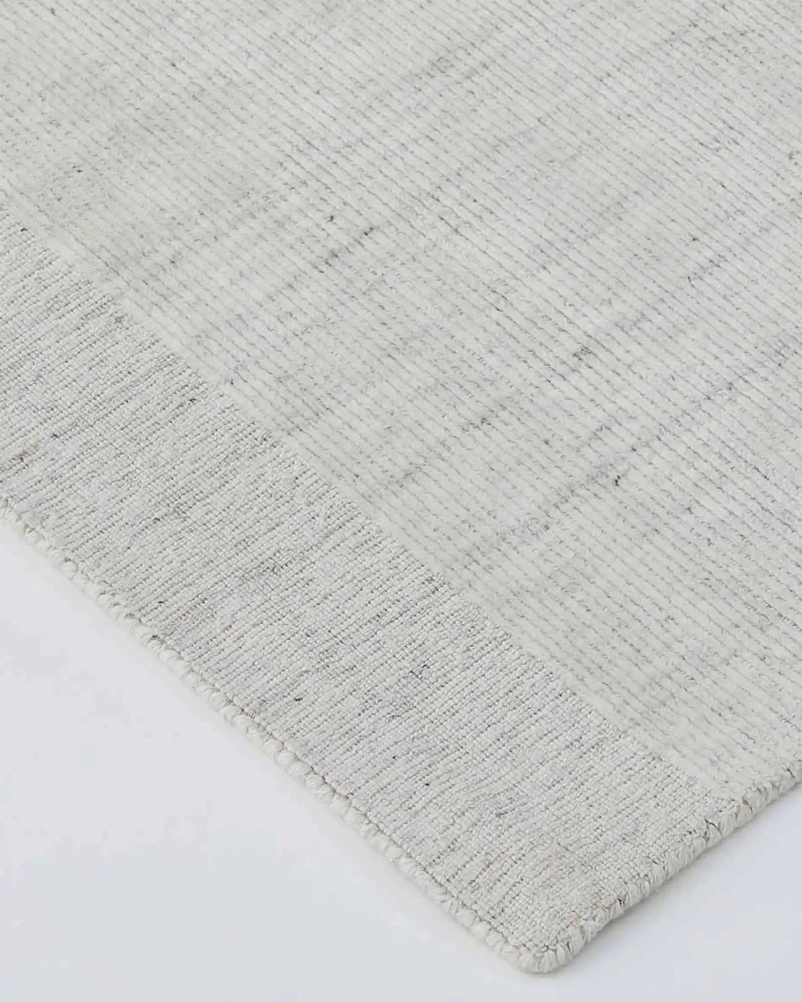 Close-up detail of the Travertine Marble Rug's texture, emphasising the blend of viscose and wool materials.