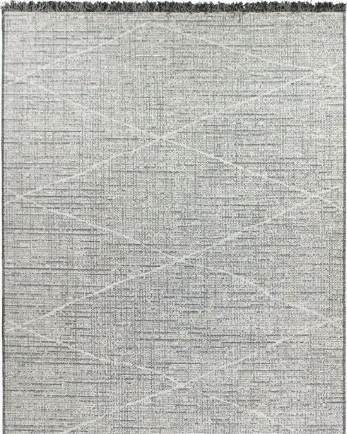 Gray area rug with geometric pattern and tassels on a plain background