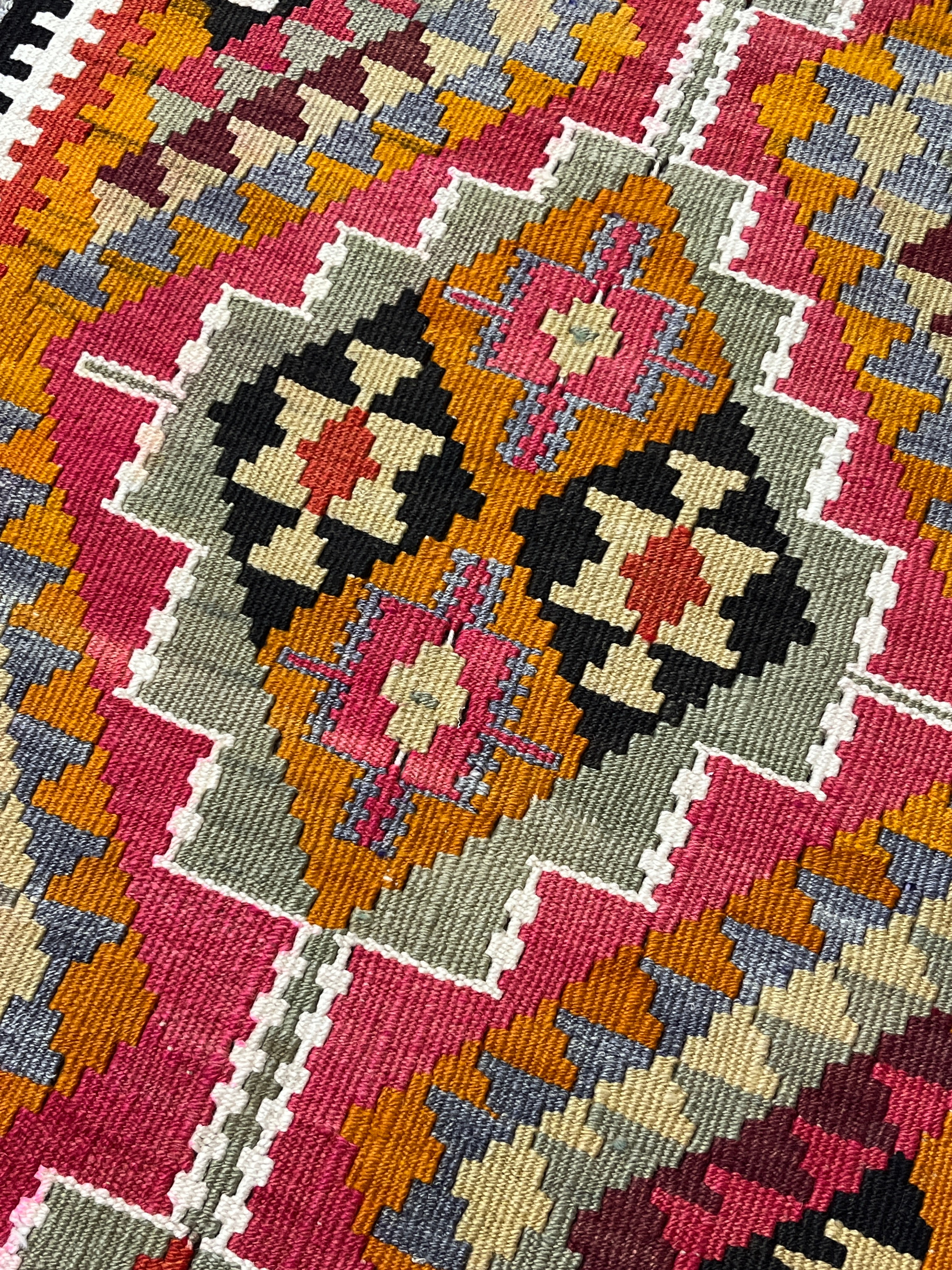 Close-up of a colorful patterned fabric with geometric design