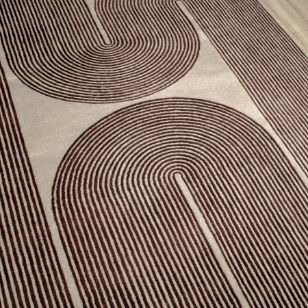 Rug with brown abstract pattern on a beige background