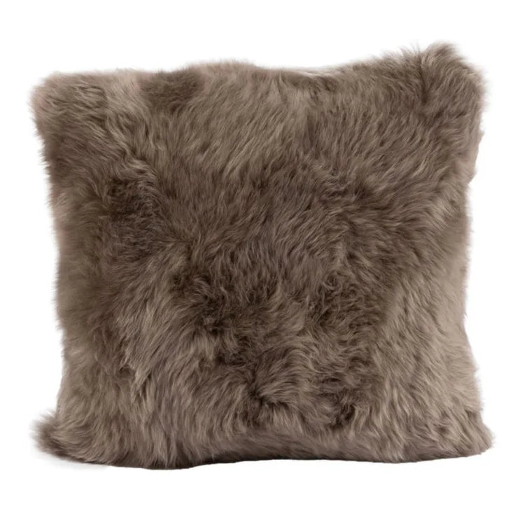 Brown sheepskin pillow on a white background
