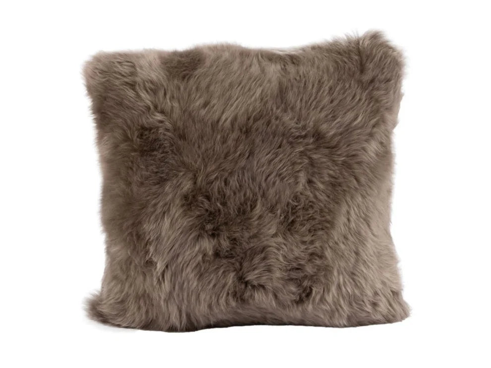Brown sheepskin pillow on a white background