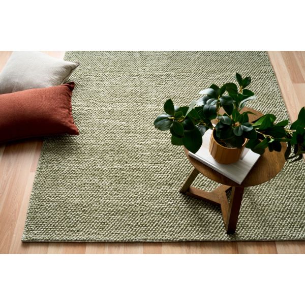 Avenue pesto rug in moder home with timber flooring and contemporary cushions