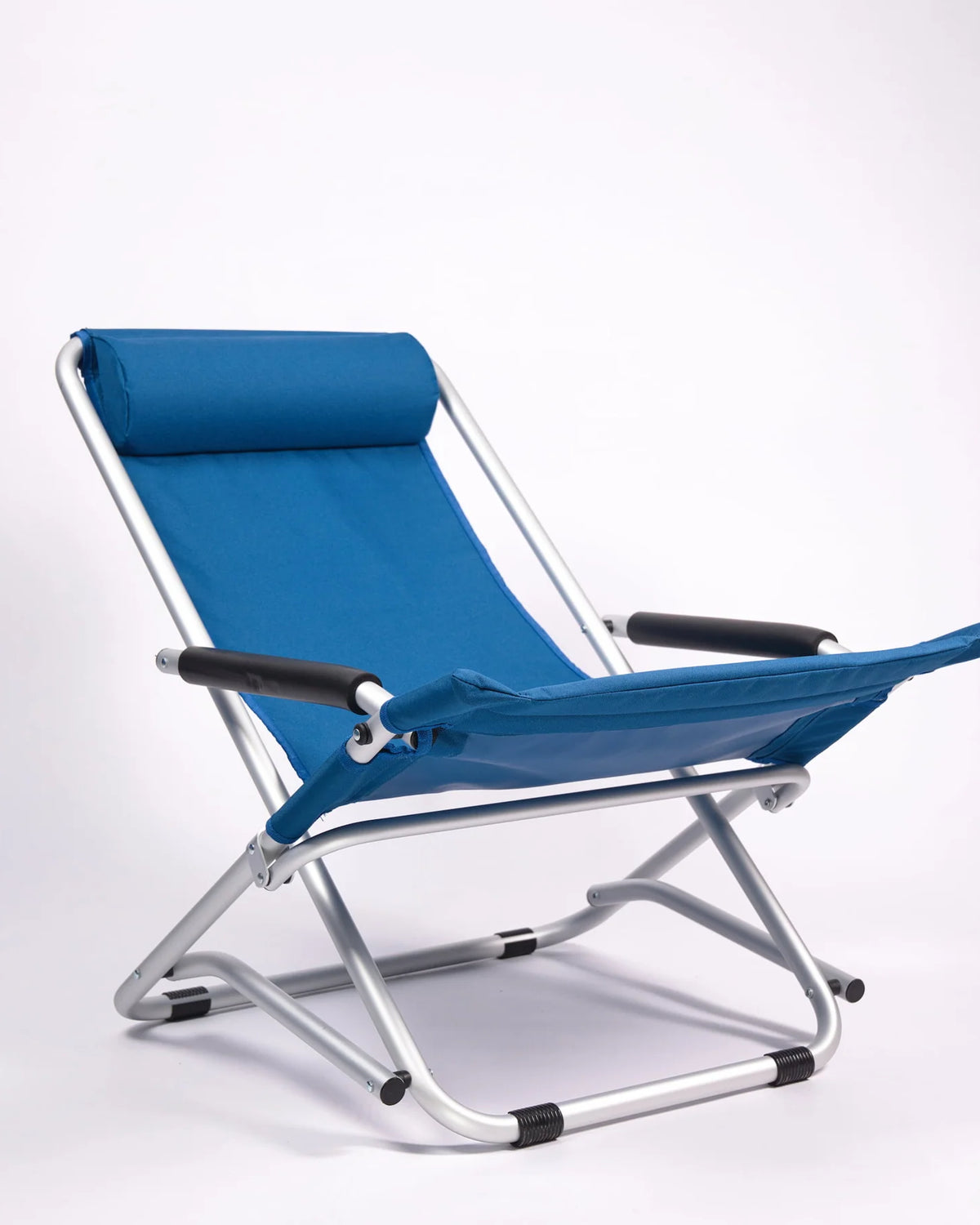 Blue folding chair with metal frame on a white background