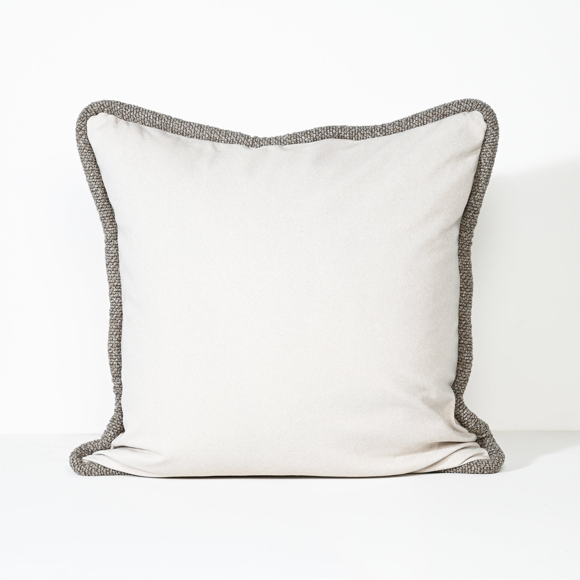 A square throw pillow with a plain off-white center and a textured gray border, shown against a clean white background.