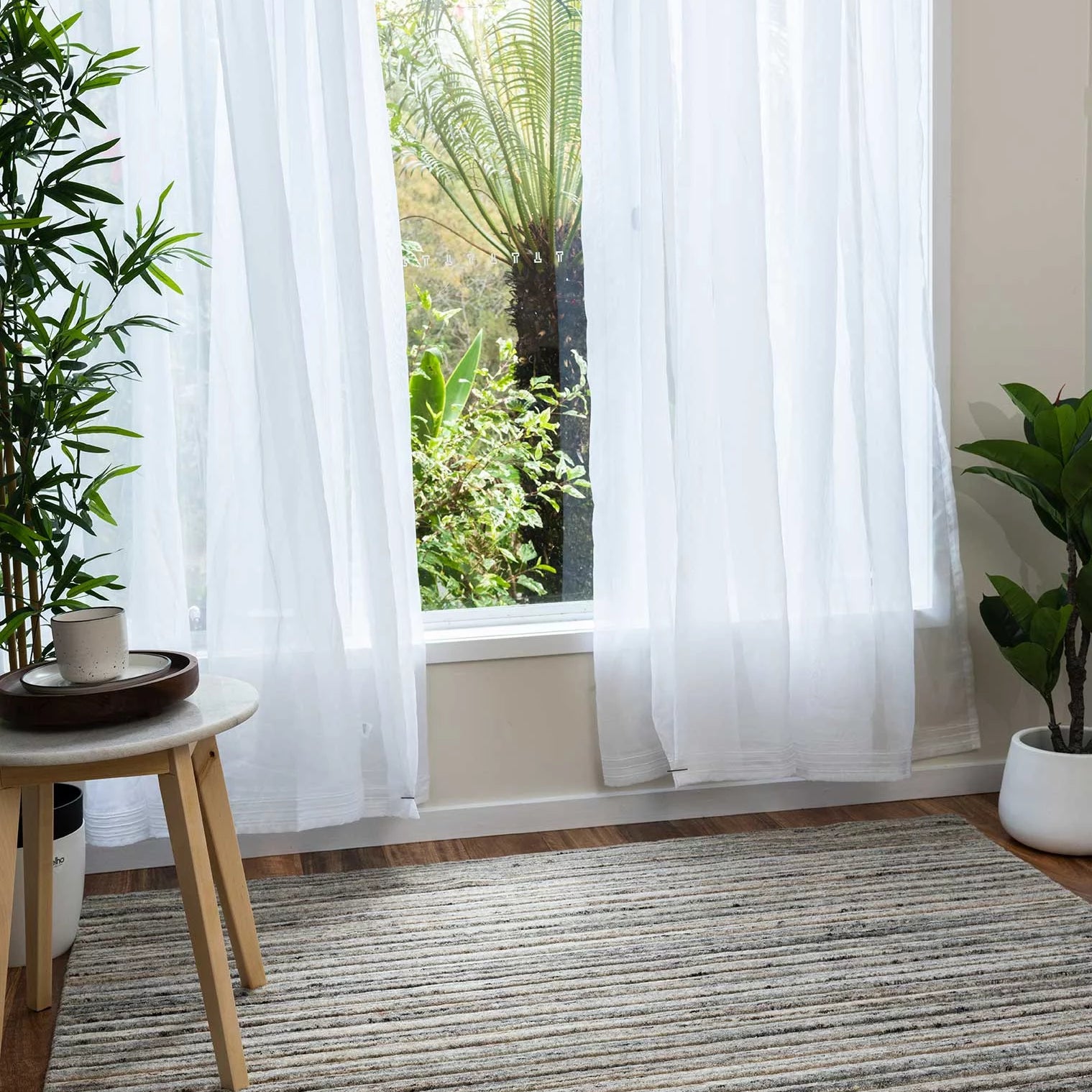 Focusing on the rug's handloom-knotted craftsmanship, this image captures the precision and quality inherent in its 80% New Zealand wool and 20% cotton composition.