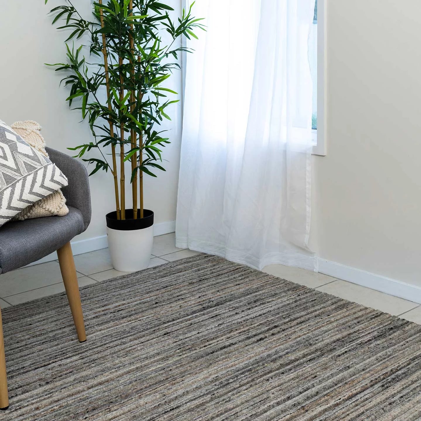 This image highlights the detailed grooved pattern and high-low finish of the rug, showcasing the luxurious texture and subtle tonal variations in the American Walnut colour.