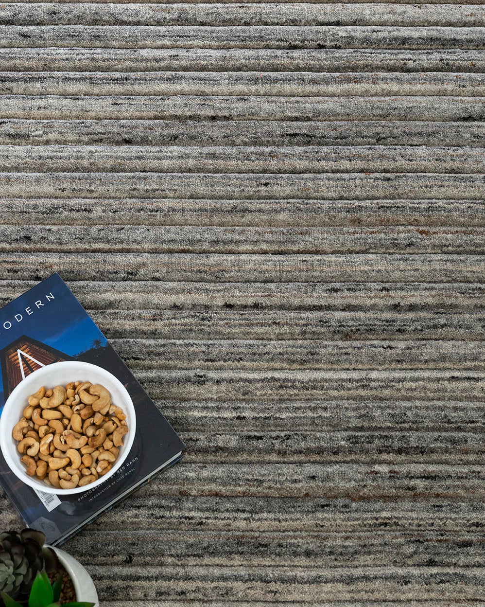 An image depicting the rug within a chic interior, illustrating how its earthy tones and contemporary design effortlessly complement Australian home decor.