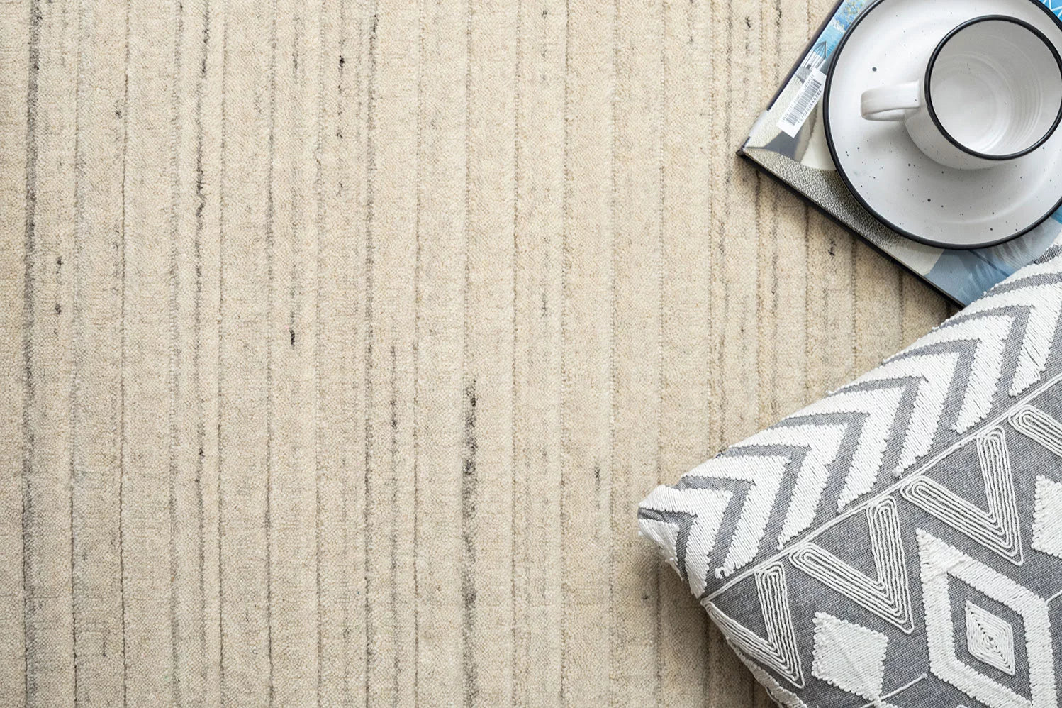 A full view of the rug bathed in natural light, demonstrating the rich texture and elegant colour palette that make it a standout piece in any setting.