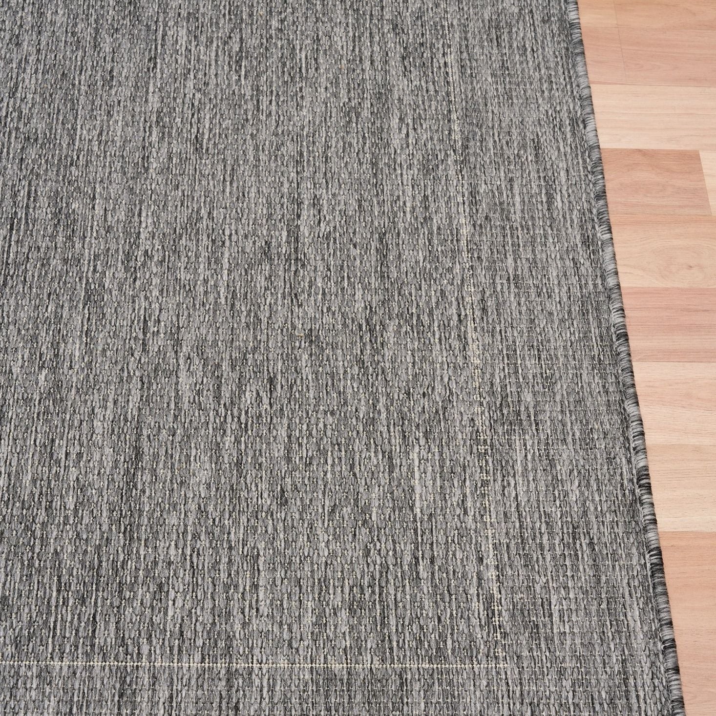 Chino silver white rug on timber flooring