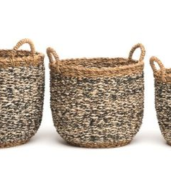 Three woven baskets of different sizes on a white background