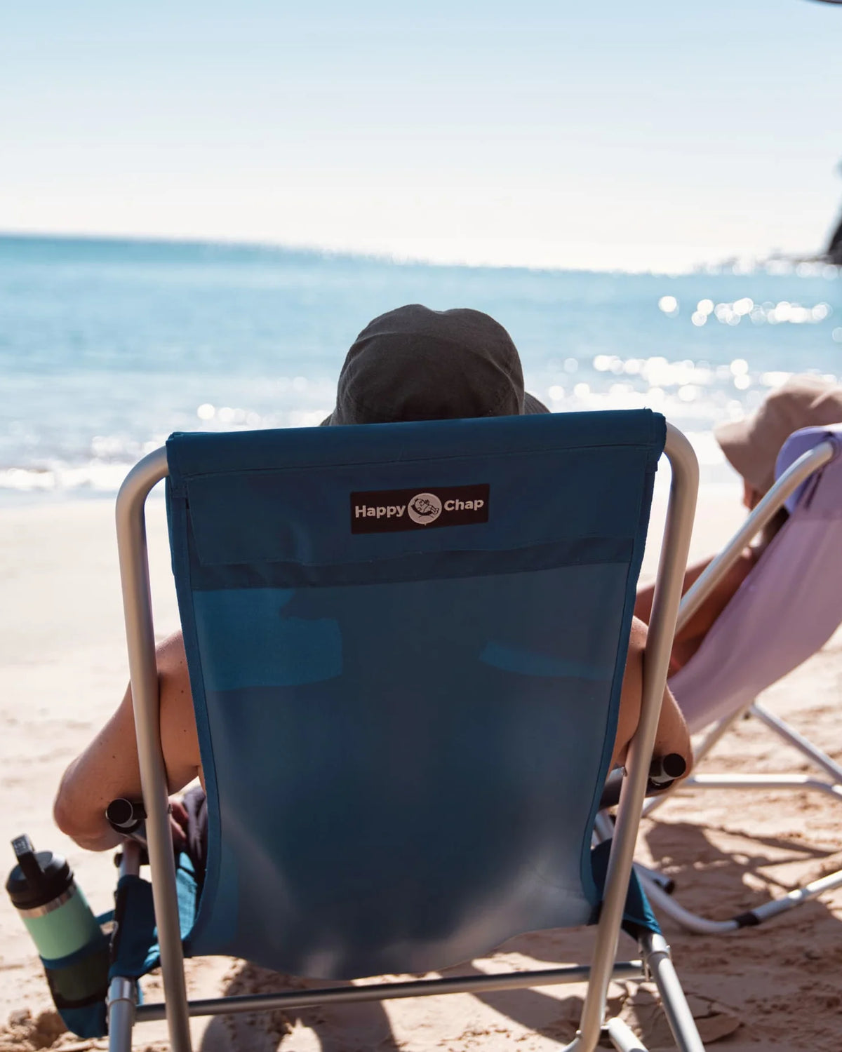 Happy chap chair on the beach at Noosa