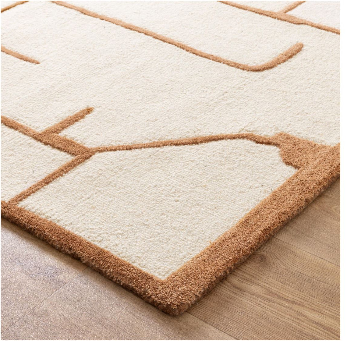 close of white beige rug on timber flooring