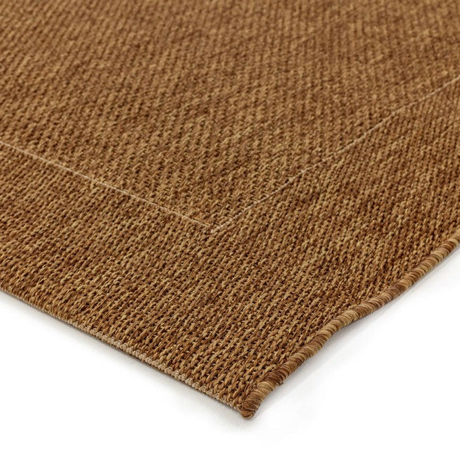 Close-up of a brown textured fabric on a white background
