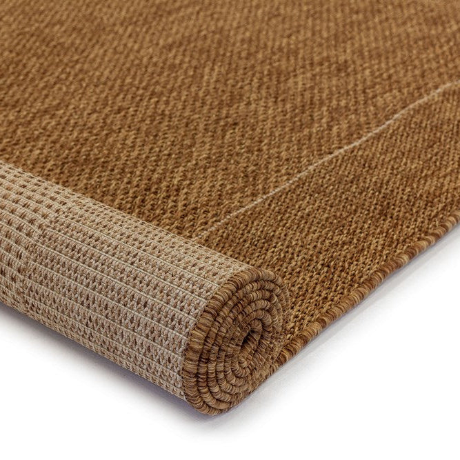 Brown textured rug on a white background