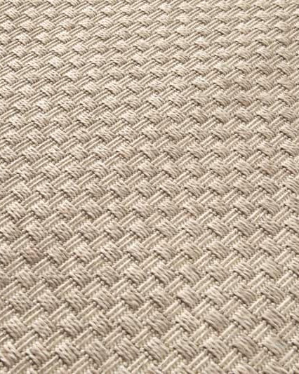 Close-up of a textured beige fabric with a diamond pattern