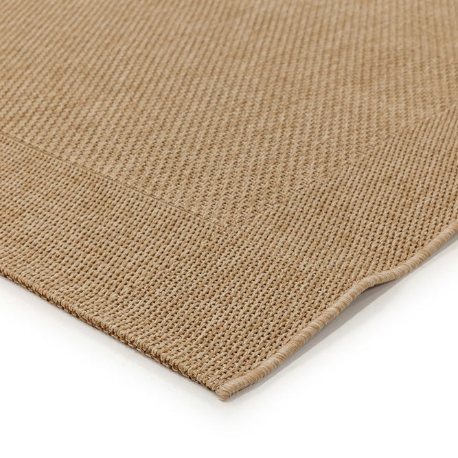 Close-up of a beige woven mat on a white background