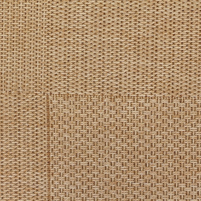 Close-up of a textured beige fabric surface