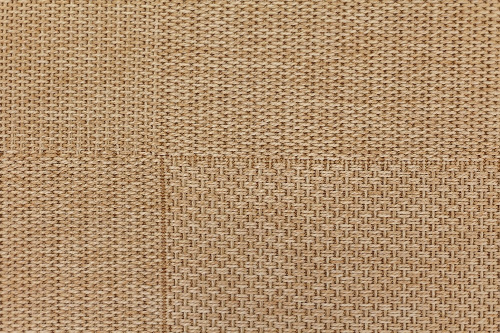 Close-up of a textured beige fabric surface